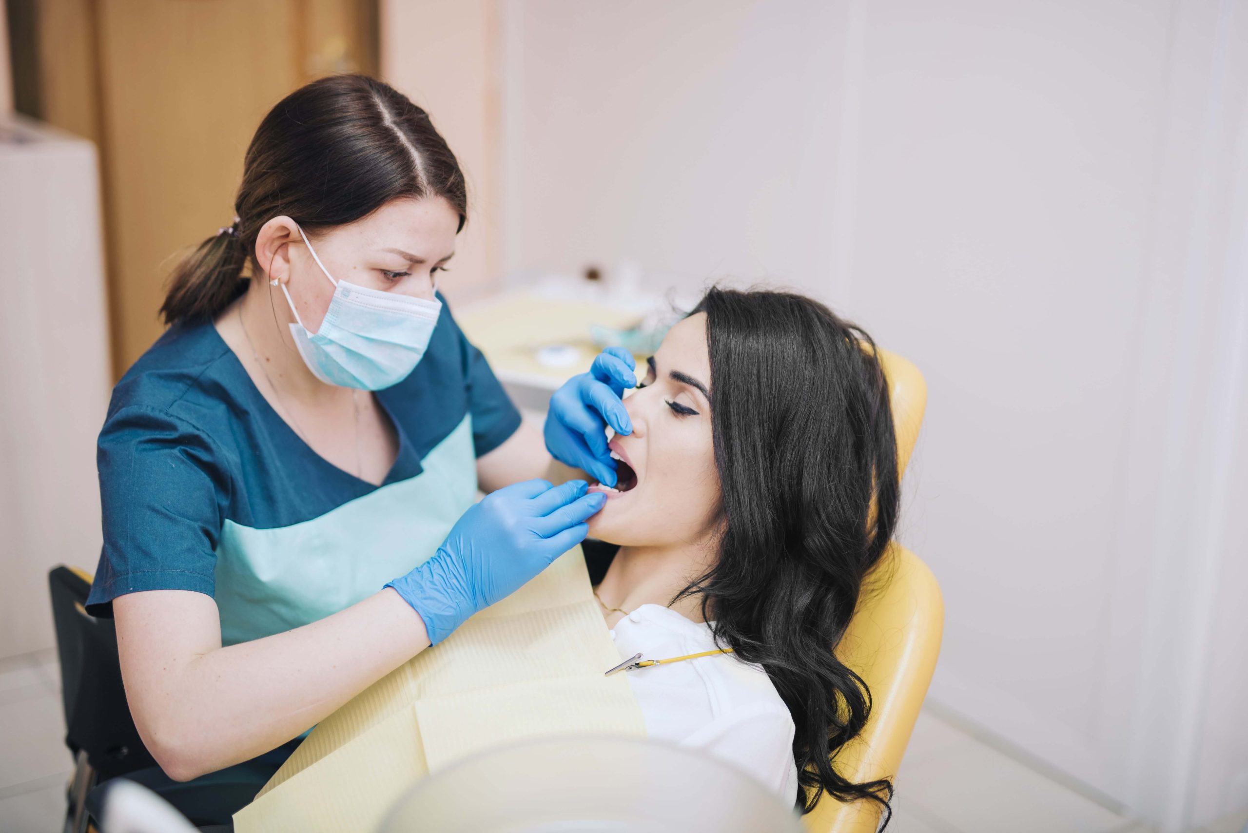 dentist curing teeth patient min (1)